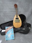 AN ITALIAN EIGHT STRING MANDOLIN, with label for Fratelli Vinaccia inside, in modern hard fitted