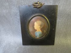 A 19TH CENTURY OVAL PORTRAIT MINIATURE OF A YOUNG CHILD, unsigned, watercolour, framed and glazed,