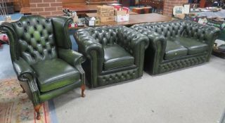 A GREEN LEATHER CHESTERFIELD SETTEE WITH CLUB CHAIR AND WINGBACK ARMCHAIR