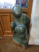 AN AFRICAN CARVED STONE SCULPTURE DEPICTING THREE FIGURES, H 75 cm