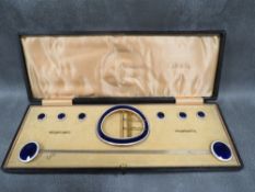 AN EARLY 20TH CENTURY GILT METAL BLUE & WHITE ENAMEL HAT PIN SET, comprising hat pin, buckle and