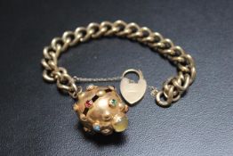 A HALLMARKED 9 CARAT GOLD BRACELET WITH LATER APPLIED GEM SET SPHERE, the sphere having the