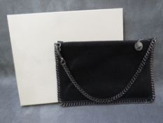 A BOXED STELLA McCARTNEY BLACK LEATHER POUCH TYPE EVENING BAG, gunmetal colour hardware, H 16 cm,