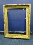 A 19TH CENTURY GOLD FRAME, with fruit and leaf design to outer edge and leaf design to inner,