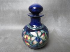 A WILLIAM MOORCROFT SPRING FLOWERS SCENT BOTTLE AND STOPPER, of globular form, impressed marks to