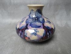 A MOORCROFT 'PANSIES' PATTERN SQUAT VASE, limited edition No. 69 / 100, impressed marks to base, H