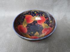 A WILLIAM MOORCROFT POMEGRANATE CIRCULAR BOWL, marks to the base, Dia. 13 cm, S/D