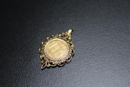 A YOUNG QUEEN VICTORIA SHEILD BACKED HALF SOVEREIGN PENDANT, mounted in hallmarked 9 carat gold,