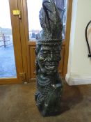 AN AFRICAN CARVED STONE SCULPTURE DEPICTING A TRIBAL MAN IN TRADITIONAL ATTIRE, 'Zulu King'