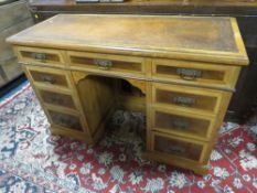 AN EDWARDIAN AESTHETIC PERIOD TWIN PEDESTAL DESK, with inset tooled leather writing surface,