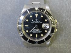 ROLEX - A STAINLESS STEEL OYSTER PERPETUAL SUBMARIMER DATE WRISTWATCH, black dial with luminous