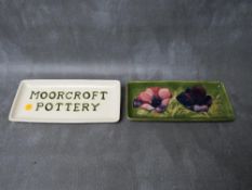 A MOORCROFT 'ANEMONE' PATTERN RECTANBULAR PIN TRAY, L 20.5 cm, together with a 'Moorcroft Pottery'