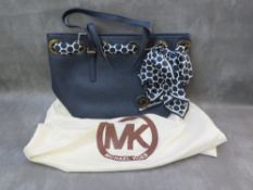 A MICHAEL KORS NAVY BLUE LEATHER TOTE BAG WITH POLKA DOT SCARF EMBELLISHMENT, with twin carry