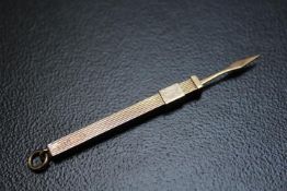A NOVELTY HALLMARKED 9 CARAT GOLD PROPELLING TOOTHPICK, approx weight 3.9g, extended L 7.5 cm