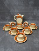 A ROYAL STAFFORDSHIRE CLARICE CLIFF 'THE BIARRITZ' PATTERN COFFEE SET, comprising a coffee set, milk