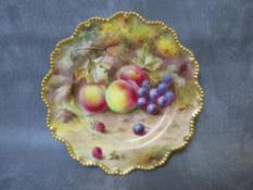 A ROYAL WORCESTER CABINET PLATE DECORATED BY L. FLEXMAN, painted with fruit and gilt decoration,