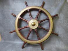 A 19TH CENTURY BRASS MOUNTED TEAK SHIPS WHEEL, with central brass boss inscribed 'Brown Bros & Co.