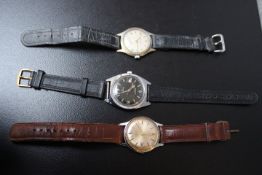 TWO SERVICES WATCHES, one with black face, together with a Junghans watch, average Dia. 3 cm (3)