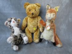 TWO VINTAGE STEIFF BEARS, to include an unusual fox hand puppet with original tag and button in ear,