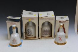 FOUR COMMEMORATIVE ROYAL BELL'S WHISKY IN CERAMIC DECANTERS, two being 50cl, two being 75cl,