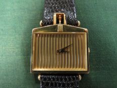 A GENTLEMANS 18K GOLD CORUM ROLLS ROYCE 'SPIRIT OF ECSTASY' WRIST WATCH, in the form of a Rolls