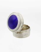An Edwardian silver and enamel pill box.