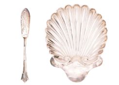A Victorian silver scallop shell butter dish and knife set by Josiah Williams & Co.