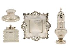 A silver caster, a silver and cut glass inkstand and a capstan inkwell.