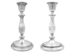 A pair of silver baluster candlesticks by Charles S Green & Co Ltd.