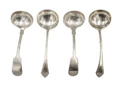 Two pairs of silver sauce ladles.
