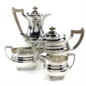 A George VI silver four piece tea set by Lowe Chester.