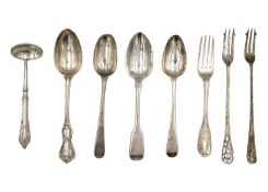 A selection of silver forks and spoons.