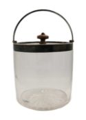 An Edwardian silver mounted glass biscuit barrel with swing handle by John Grinsell & Sons.