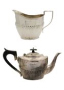 A Victorian silver half fluted two piece tea set by Barker Bros.