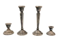 A pair of modern silver candlesticks.