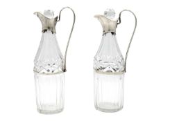 A pair of George III silver-mounted cut glass oil bottles.