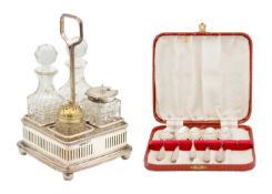 A Victorian silver cruet frame with four bottles by Walker & Hall.