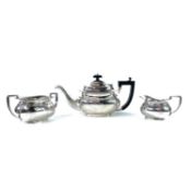 A George V silver three piece tea set by William Adams.