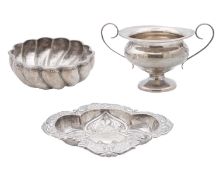 A modern heavy silver wrythen sugar bowl, a twin handled cup and a bon bon dish.