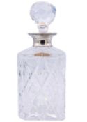 A modern silver-mounted cut glass whisky decanter and stopper.