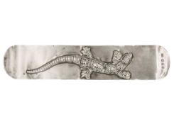 A silver bookmark applied with a lizard by Gwen Whicker.
