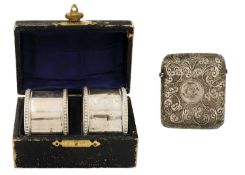 A cased pair of silver napkin rings and a vesta case.