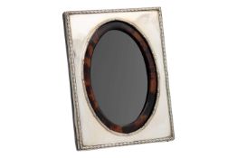 A good George V silver and tortoiseshell photograph frame by Henry Matthews.