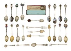 A collection of hallmarked and .800 silver spoons and forks, various are souvenirs with enamel.