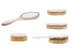 A George V silver engine turned four-piece dressing table set by James Dixon & Sons Ltd.
