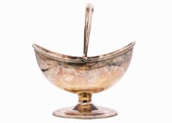 An Edwardian silver swing-handled pedestal sugar basket Stokes & Ireland Ltd.