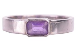 An amethyst single stone ring, featuring an emerald cut amethyst measuring 6 x 4.2 x 3mm, horizontal