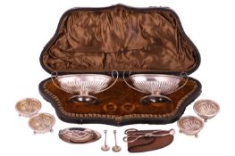 A pair of silver salts in case, a pair of silver sugar nips, a set of four silver salts with two spo