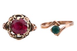 Two rings tested as 14ct gold; the first featuring a round red paste in a yellow metal surround with