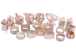 A mixed collection of silver and white metal items, assorted cruets and napkin rings, various dates 